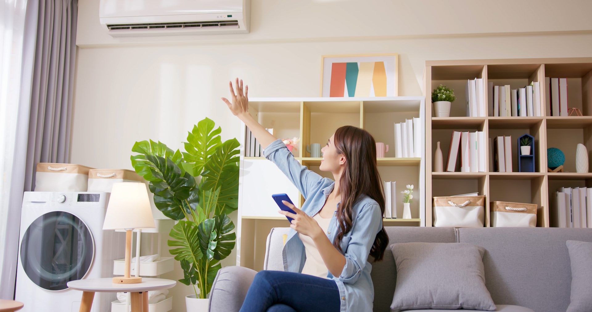 Woman relaxing at home with the air conditioning running